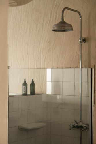 a shower in a bathroom with a glass shower stall at Casa Atlantida - Sea front in Faja Grande