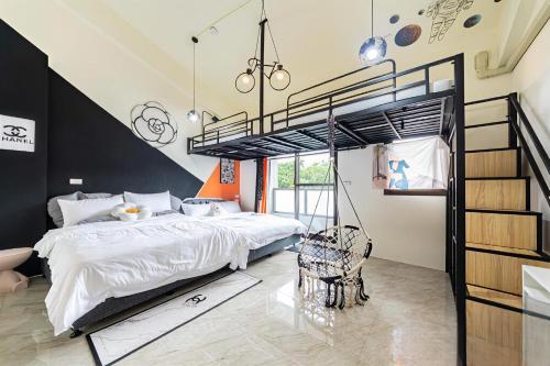 a bedroom with a loft bed with a swing at 原森民宿B&b包棟最佳選擇 in Wujie