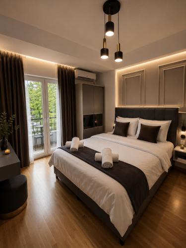 a large bedroom with a large bed with white pillows at Petreski Apartments 1 in Ohrid