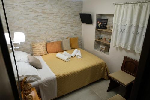 a bedroom with a bed with towels on it at Evi's House in Kandia