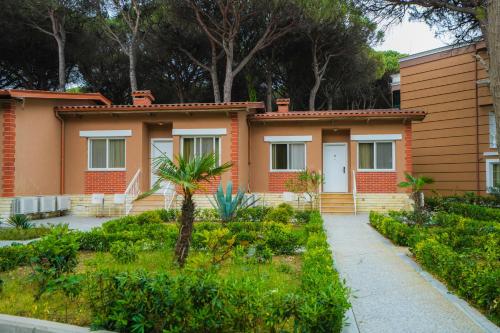a house with a garden in front of it at Prestige Resort in Golem