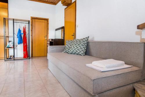 a couch sitting in a living room at Lena Apartments 4 in Potos