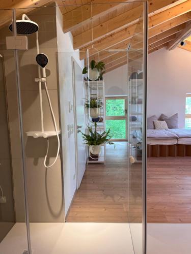 a room with a glass door leading to a bedroom at Mitteraubach in Jandelsbrunn