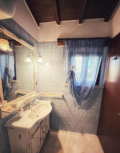 a bathroom with a sink and a mirror at alloggio turistico Castel di Salce in Viterbo