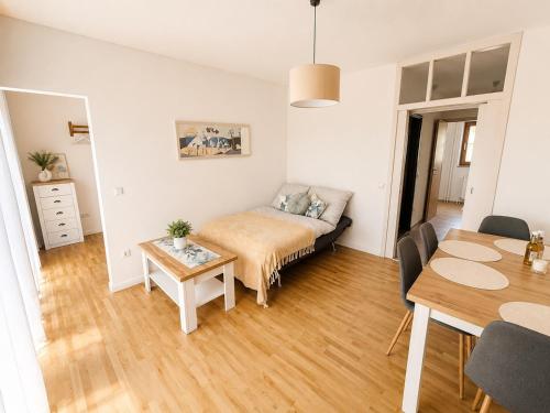 a living room with a bed and a table at Apartment Harbach in Harbach
