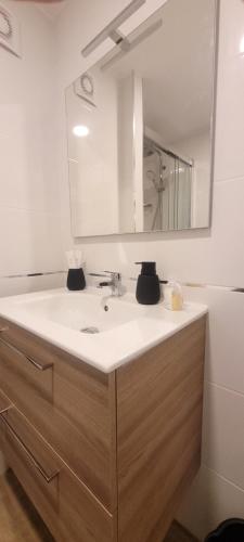 a bathroom with a sink and a mirror at Calpe vistas al mar in Ifach