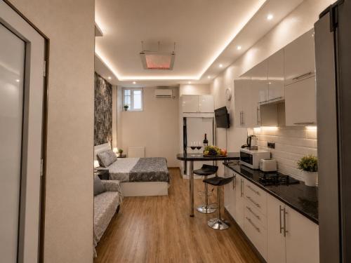 a small apartment with a bed and a kitchen at Old Tbilisi Georgian Soul in Tbilisi City
