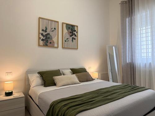 a bedroom with a bed and a window at Room 28 in Conversano