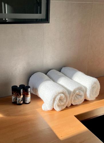 a bunch of rolls of toilet paper on a counter at SunkissedVilla in Draç