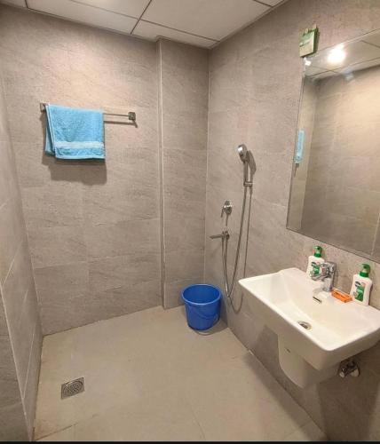 a bathroom with a sink and a shower at Apex Hub in Greater Noida