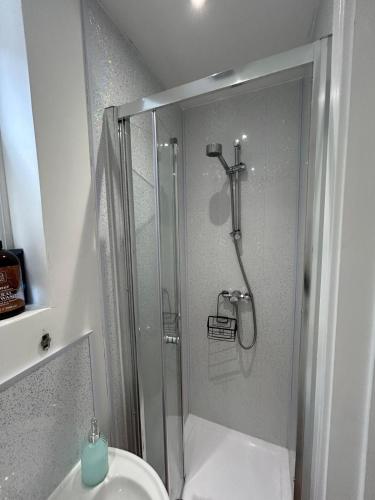 a bathroom with a shower and a toilet and a sink at Self-Contained Studio with Ensuite & Private Access in Hardwicke