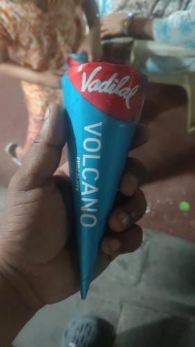 a hand holding a container of toothpaste at Vipul in Kasrāwad