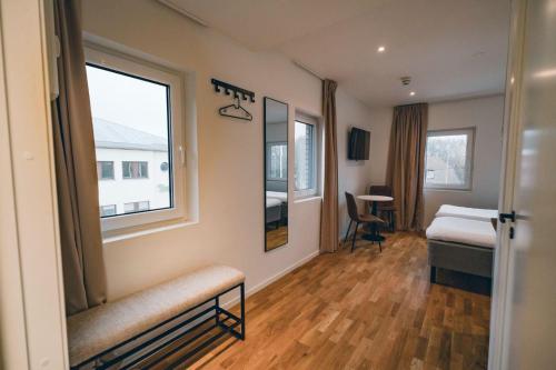a hospital room with a bed and a window at Edsviken Hotell in Stockholm