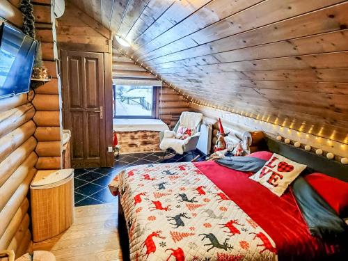 a bedroom with a bed in a log cabin at House Villa Ursus in Gerovo