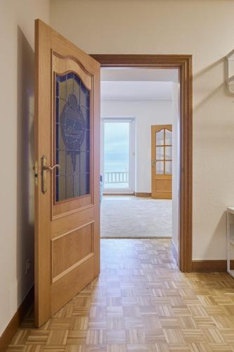 an open door with a view of a room at Kai in Getaria
