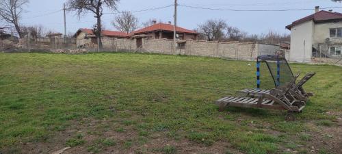 a playground in the middle of a yard at Вила Никови in Durankulak