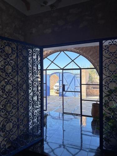 an entrance to a room with a glass door at Dar Joud Kaouki in Sidi Kaouki