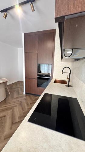 a kitchen with a sink and a counter top at Mar'al Mar Luxury Escape in Himare