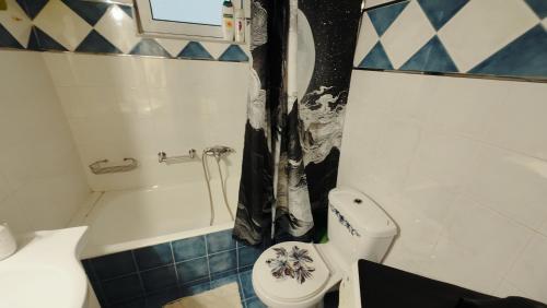 a small bathroom with a toilet and a shower at Dream Home in Sparta