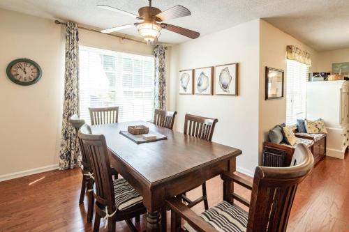 a dining room with a table and chairs at Herons' Haven in Charleston