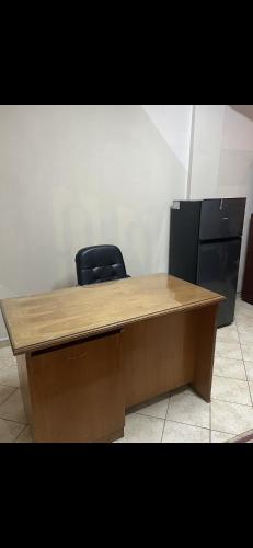 a wooden desk with a chair in an office at Monoambiente Ejecutivo in Villarrica