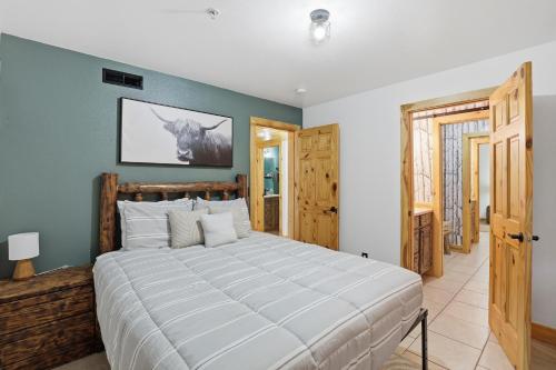 a bedroom with a large bed in a room at The Lodge at Duck Creek in Duck Creek Village
