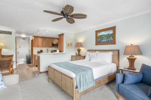 a bedroom with a bed and a living room at Lahaina Shores #532 in Lahaina