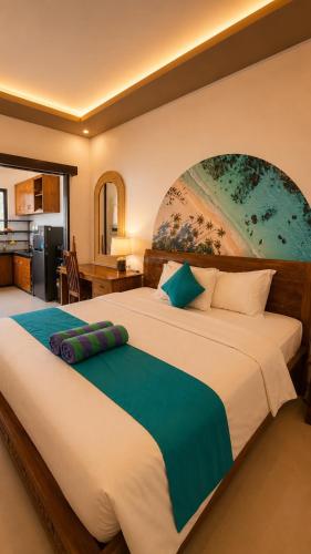 a bedroom with a large bed with a painting on the wall at Cahya Pandawa Villa in Nusa Dua