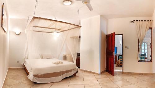 a bedroom with a bed in a room at Kasa First Apartment in Mtwapa