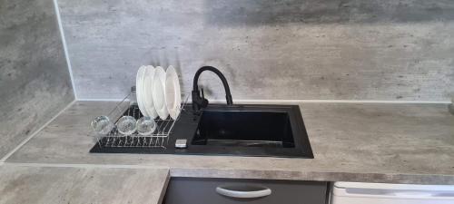 a kitchen counter with a sink and a counter top at Paradies Caraïbes II in Les Abymes