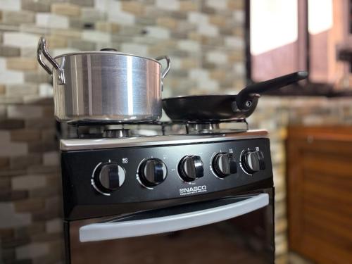 a pot on top of a stove in a kitchen at Luxury résidence Bassam in Moosou