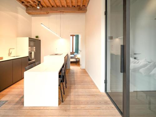 a kitchen with a white counter top in a room at Stylish Duplex for 6 in Antwerp in Antwerp