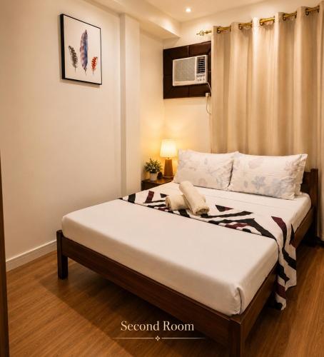a bedroom with a bed in a room at Davao City Stay at Camella Northpoint Spacious 3BR Condo 5Beds Up to 10 Guests in Davao City