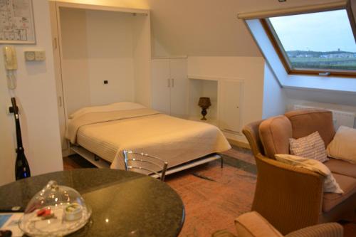 Een bed of bedden in een kamer bij PS Orion