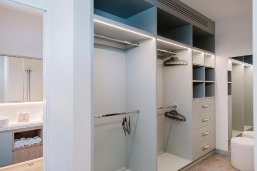 a walk in shower in a bathroom with white cabinets at Lakeside House - Waterfront, Spacious, Pool Table in Yatte Yattah