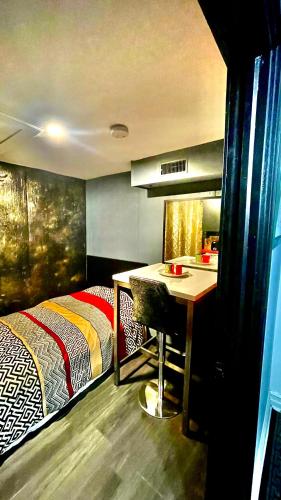 a bedroom with a bed and a desk and a table at Luxury KIA Room E in Richmond Hill