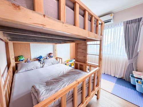 a bedroom with a bunk bed with two bunk beds at K2 Pool Villa Khaoyai in Ban Sap Setthi