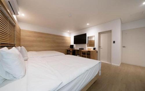 Llit o llits en una habitació de gimhae samgye next hotel