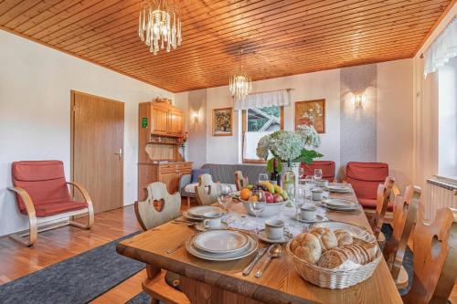 a dining room with a table with food on it at House Marija with BBQ & Garden - Happy Rentals in Gradišča