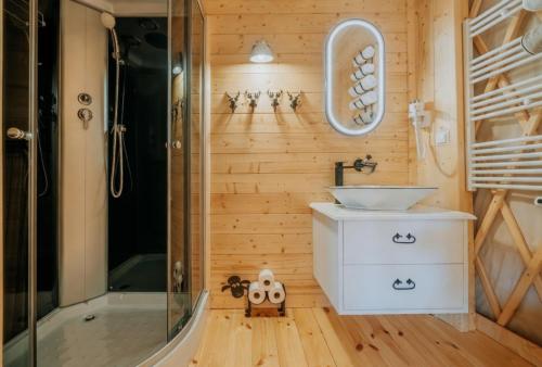 a bathroom with a sink and a shower at Jurta na Wypasie - luksusowy namiot z widokiem na góry - Jacuzzi, Sauna, Split AC, Private, Star View in Zakopane