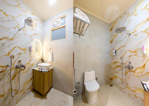 a bathroom with a toilet and a sink at Hotel Silver Star in Greater Noida