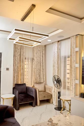 a living room with a couch and a chair at Lekki Abijo Apartment in Lekki
