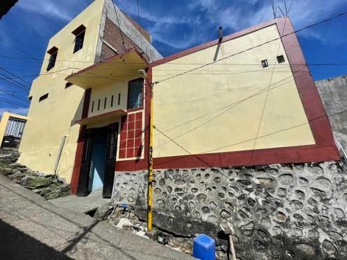 a building on the side of a street at EXPRESS O 91669 Kost Amel Near Taman Mattirotasi in Parepare