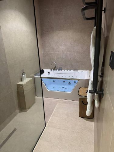 a bathroom with a bath tub in a room at Lazgi Boutique & Spa Hotel in Khiva