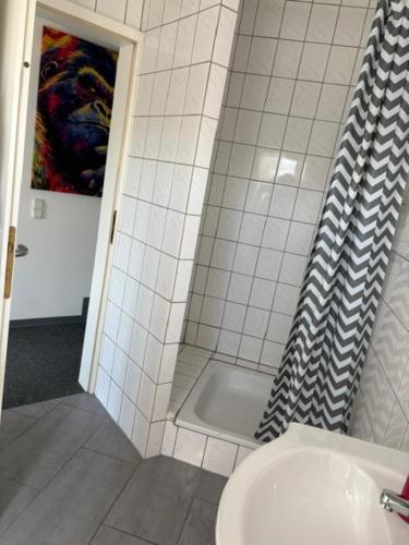 a bathroom with a shower and a toilet and a sink at Appartement am Peterstor in Montabaur