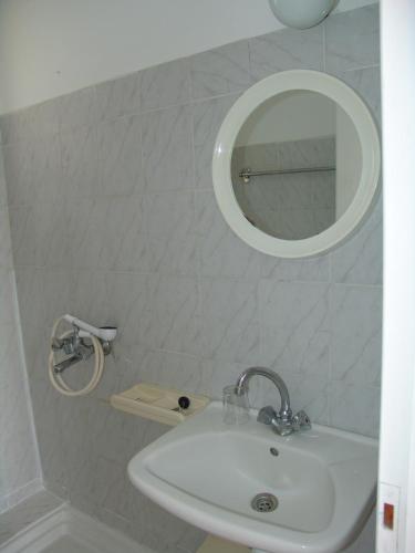 a bathroom with a sink and a mirror at Irene Studios in Kefalos