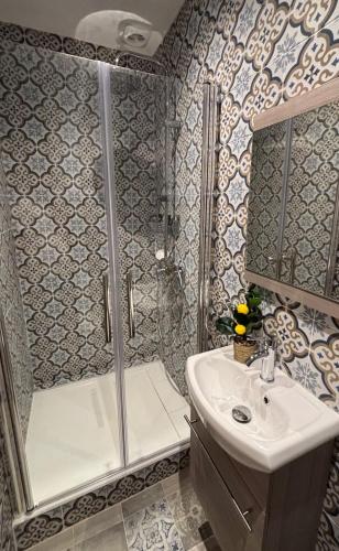 a bathroom with a shower and a sink at Gambetta in Arles