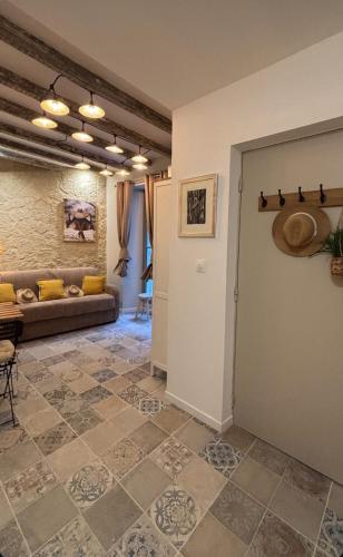a living room with a couch and a table at Gambetta in Arles