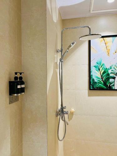 a shower with a shower head in a bathroom at Khách sạn Solea VIỆT TRÌ in Việt Trì
