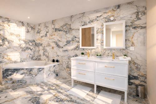 a bathroom with a white sink and a mirror at Villa Prestige - Maison d Hôtes avec Piscine, Billard et Parking Privé - Centre 5 min - Proche A7-A9 in Orange